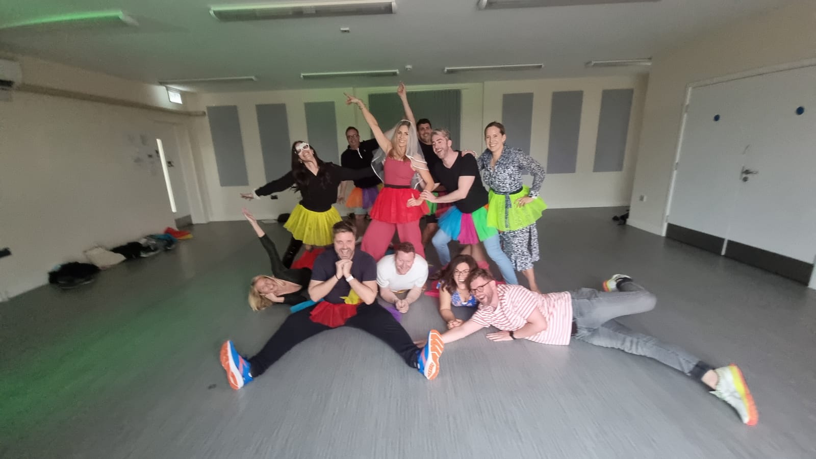 Happy hen party group dancing ABBA style in Brighton