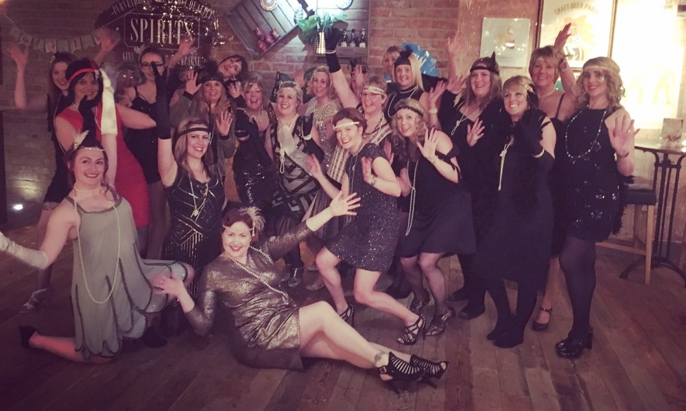 Happy hen party group dancing Moulin Rouge style in Brighton